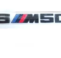 EMBLEMA TRASERO BMW X6M50D NEGRO