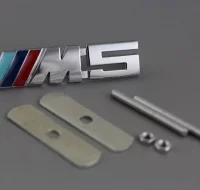 EMBLEMA PARRILLA BMW M5 PLATA