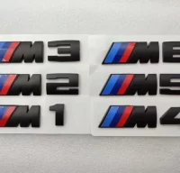 EMBLEMA PARRILLA BMW M5 NEGRO