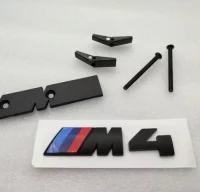 EMBLEMA PARRILLA BMW M4 NEGRO